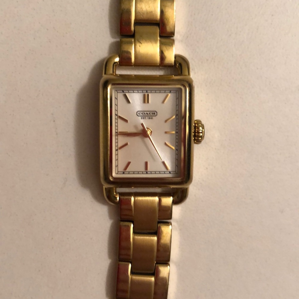 Lightly worn gold coach watch. Batteries work.